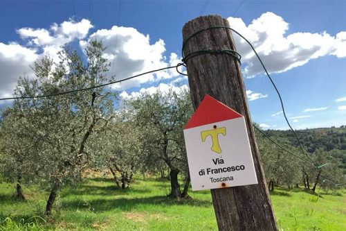 Wooden sign of Via di Francesco in Toscana