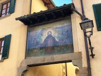 Painting of St Francis on the walkway in Stia, fresco by Pietro Annigoni