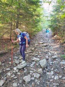 Female hiker using a walking pole while walking the Way of St Francis