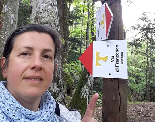 Marta points to the Way of St Francis sign