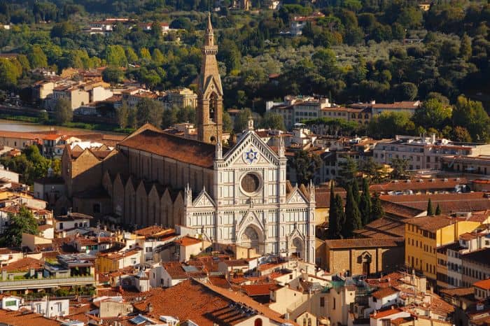 View of Basilica of Santa Croce with Arno river in the background. Santa Croce is the official starting point of the Via di Francesco in Florence.